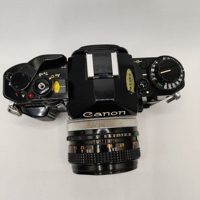 Canon A-1 35mm SLR Film Camera - Black (50mm Lens Kit)