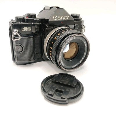 Canon A-1 35mm SLR Film Camera - Black (50mm Lens Kit)